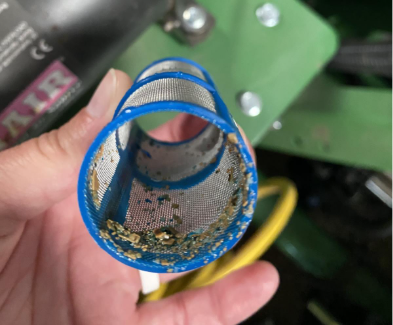 Inside of a clogged spreader strainer.