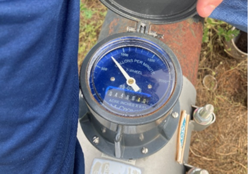 Image of flow meter around the irrigation pipe